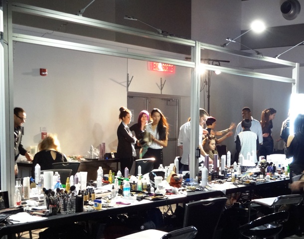 Busy with hair and makeup. Photo by Alan Viau