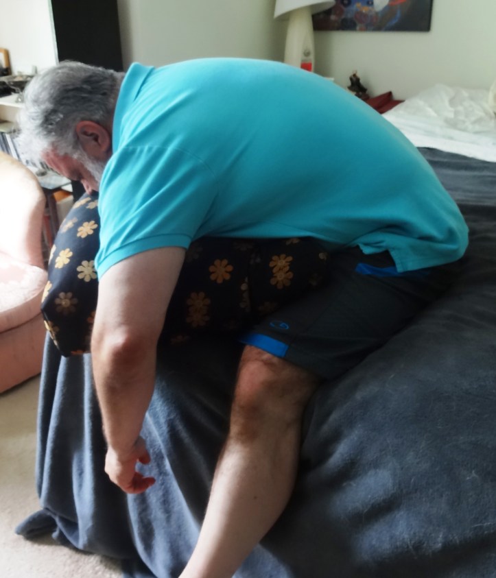 Wide Leg Forward Bend to relax your back, shoulders and neck.